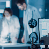 group scientists working lab